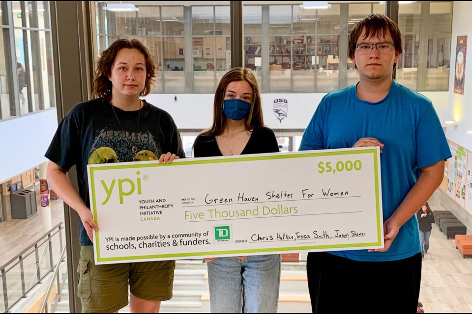 From left: Chris Hutton, Tessa Smith and Jason Shearer are shown with a cheque for the Green Haven Shelter for Women.