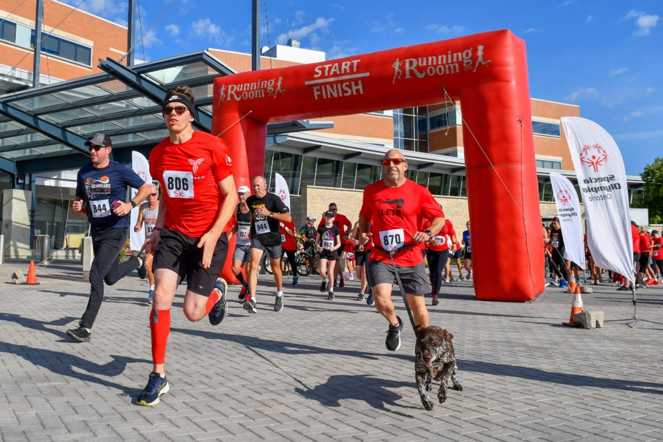 Participants of the 5km route take off from a shotgun start Sunday at the 2023 OPP Guardians Run, part of the Law enforcement Torch Run for Special Olympics Sunday.