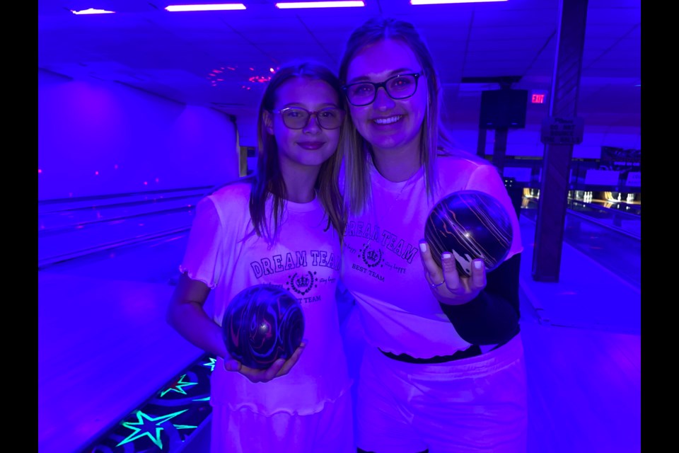 Big Sister Lauren Oke, right, and her  Little Sister Mia, left, spent Tuesday night having fun at the Bowl for Kids’ Sake event. 