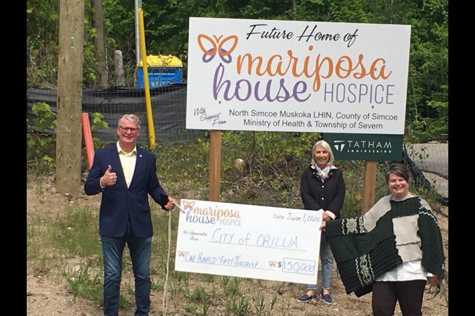 Mariposa House Hospice is grateful to the City of Orillia for being a major contributor to the Honouring Every Moment Capital Campaign.  This generous donation has been directed to the front portico. From left: Mayor Steve Clarke, City of Orillia, Sylvia Smith, board member, and 
Annalise Stenekes, executive director.