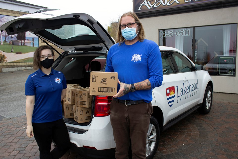 Lakehead University Student Alumni Association vice-president Taylor Smith delivered disinfectant wipes to Kevin Gangloff, director of the Orillia Youth Centre. Supplied photo