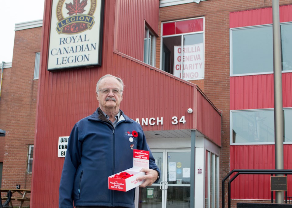 rick purcell outside legion with poppy box