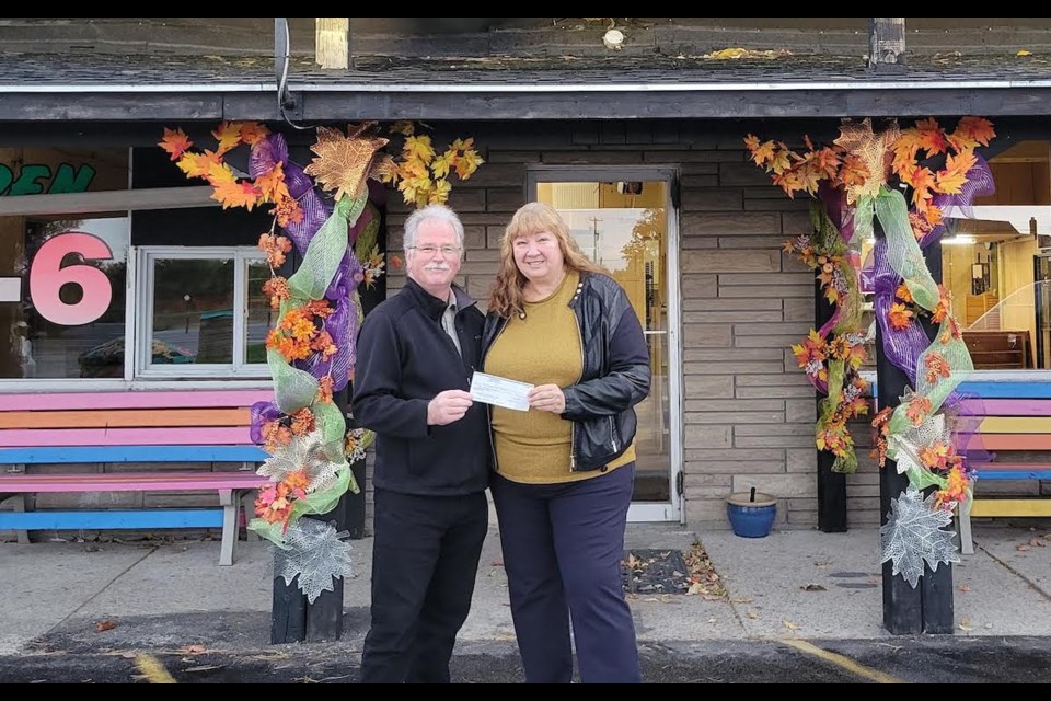 Dean and Rita Robinson, retiring owners of The Candy Shoppe, raised $4,000 for the Sharing Place Food Centre last weekend.