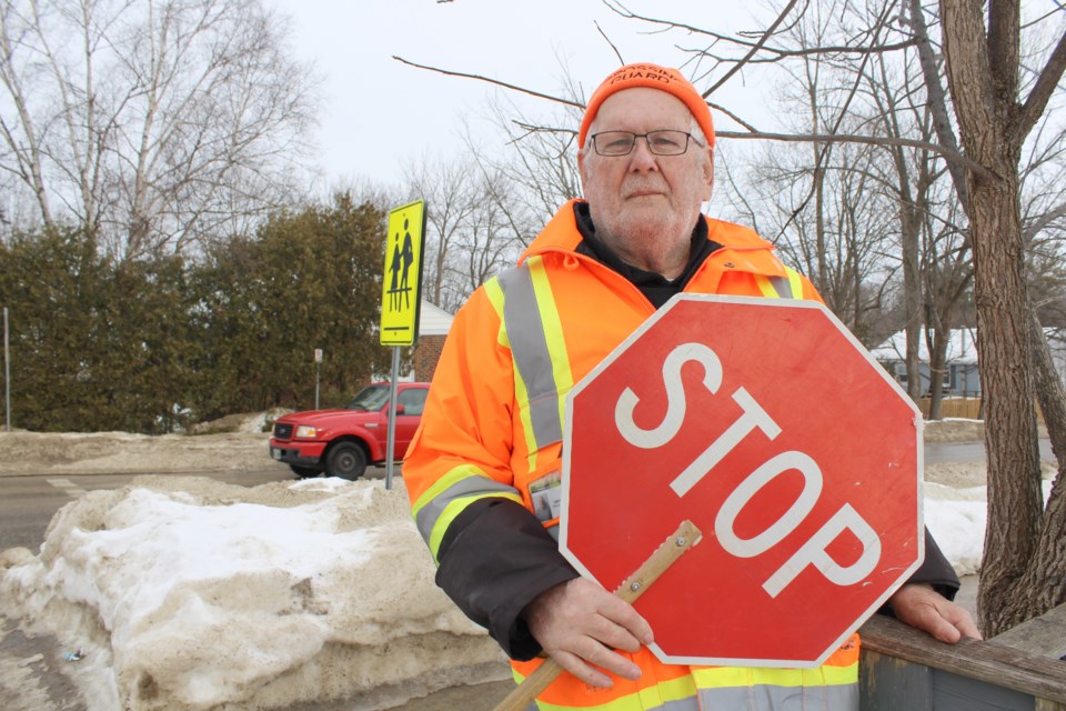 Carl White has been helping children safely across the intersection at Westmount Drive and George Street for 15 years. (Nathan Taylor/OrilliaMatters