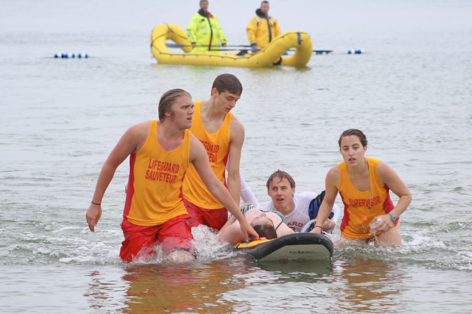 Lifeguards bring a "victim" to shore Wednesday at Moose Beach during a mock drowning exercise. Nathan Taylor/OrilliaMatters