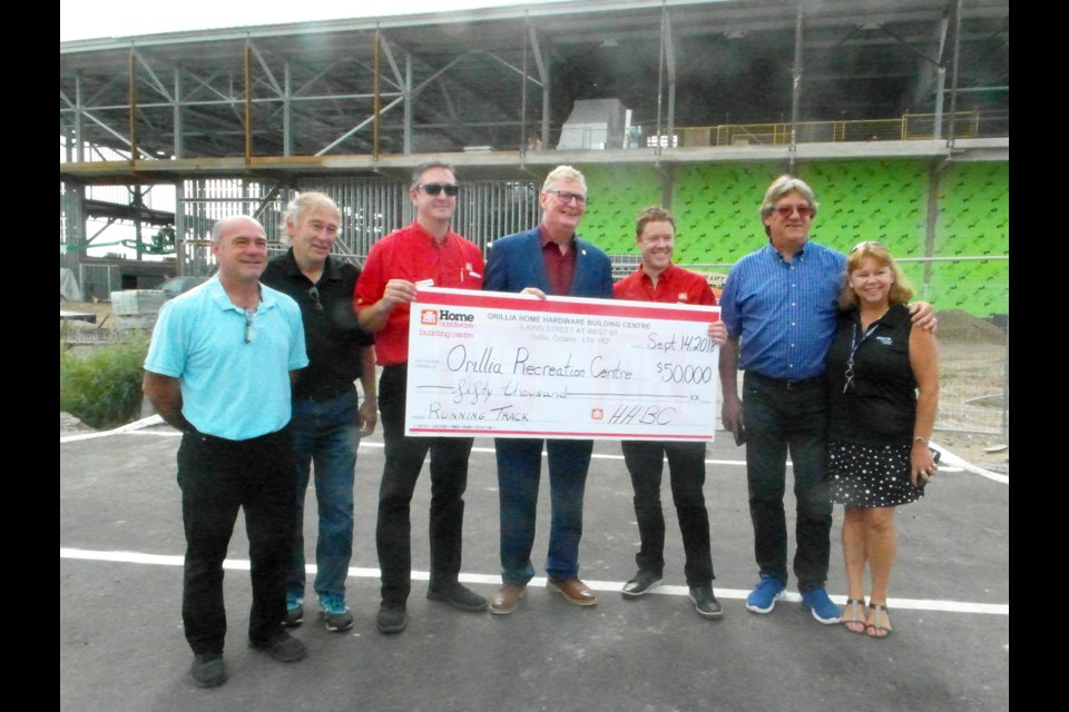 Orillia Home Hardware Building Centre donated $50,000 to the Orillia Recreation Centre project for naming rights to the running track. Pictured are, from left: Paul Valle, member of the Orillia Recreation Centre (ORC) fundraising group, Wes Trinier, member of the ORC fundraising group, Chris Locke, co-owner, Orillia Home Hardware Building Centre, Mayor Steve Clarke, Kirk McLean, co-owner, Orillia Home Hardware Building Centre, Mike Davenport, chair of the ORC fundraising group, and Deb Wagner, member of the ORC fundraising group. Submitted photo