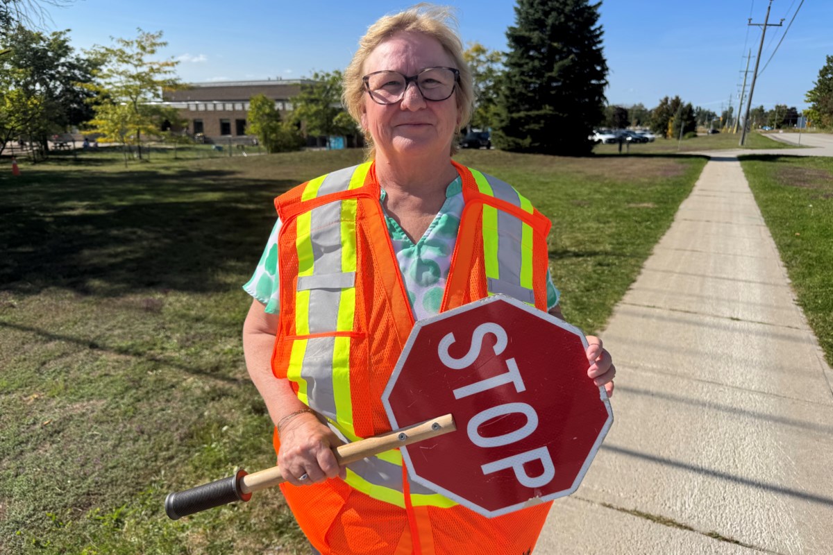 'The traffic around the four-way stop here, it’s just crazy,' says crossing guard of need to have people in place to help local students