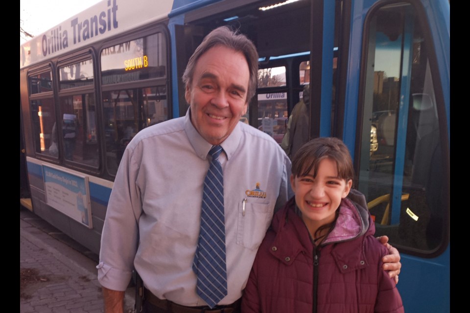 Orillia Transit driver John Young is shown with Alissia Martin's daughter, Brookie.