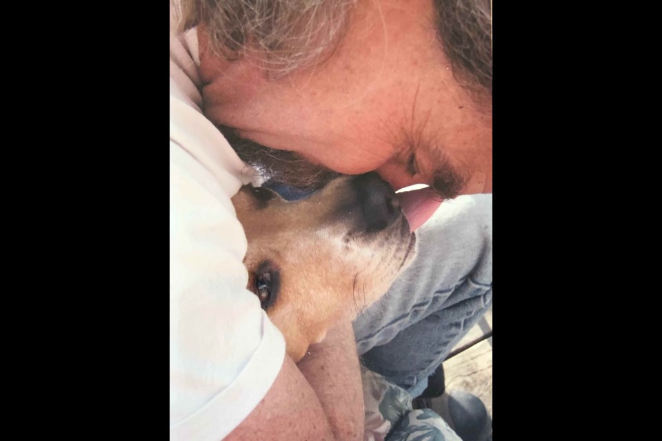 John Epstein enjoys a quiet moment with his much-loved beagle, Arthur.
