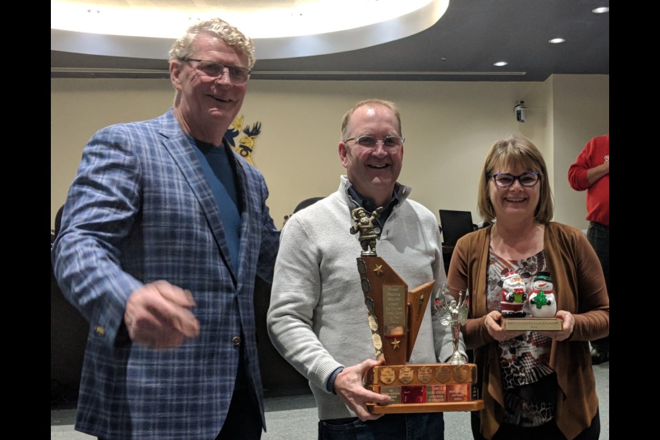 Orillia Floor Fashion owners Dean and Roseanne Beers won the top prize at this year's Santa Claus Parade. On Monday night, Mayor Steve Clarke presented them with the Santa's Choice Award for best overall float. Dave Dawson/OrilliaMatters