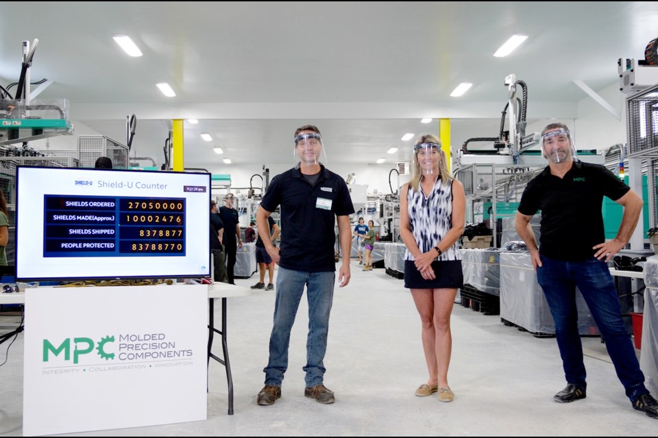 Molded Precision Components recently produced its 10 millionth face shield. Pictured, from left, are company vice-president Thomas Woegerer, Simcoe North MPP Jill Dunlop and company president and co-owner David Yeaman. Supplied photo