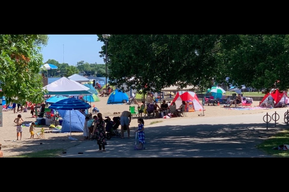 Couchiching Beach Park was crowded again Saturday as people flooded the area to get respite from the heat wave. So far this weekend, local bylaw officers have levied three $750 tickets for violations of provincial COVID-19-related restrictions. Contributed photo