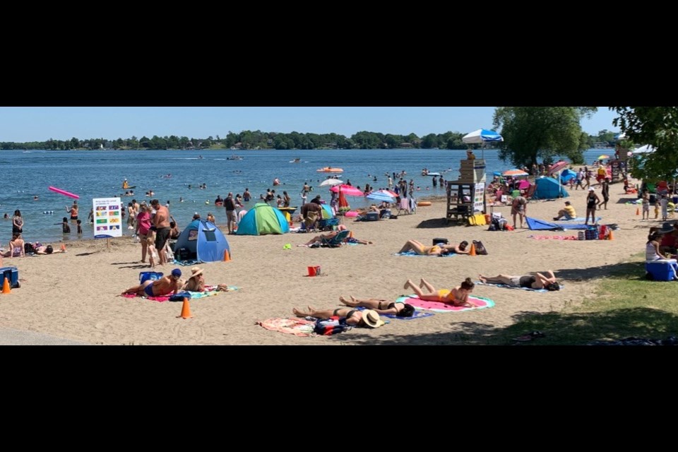 Couchiching Beach Park was crowded again Saturday as people flooded the area to get respite from the heat wave. So far this weekend, local bylaw officers have levied three $750 tickets for violations of provincial COVID-19-related restrictions. Contributed photo