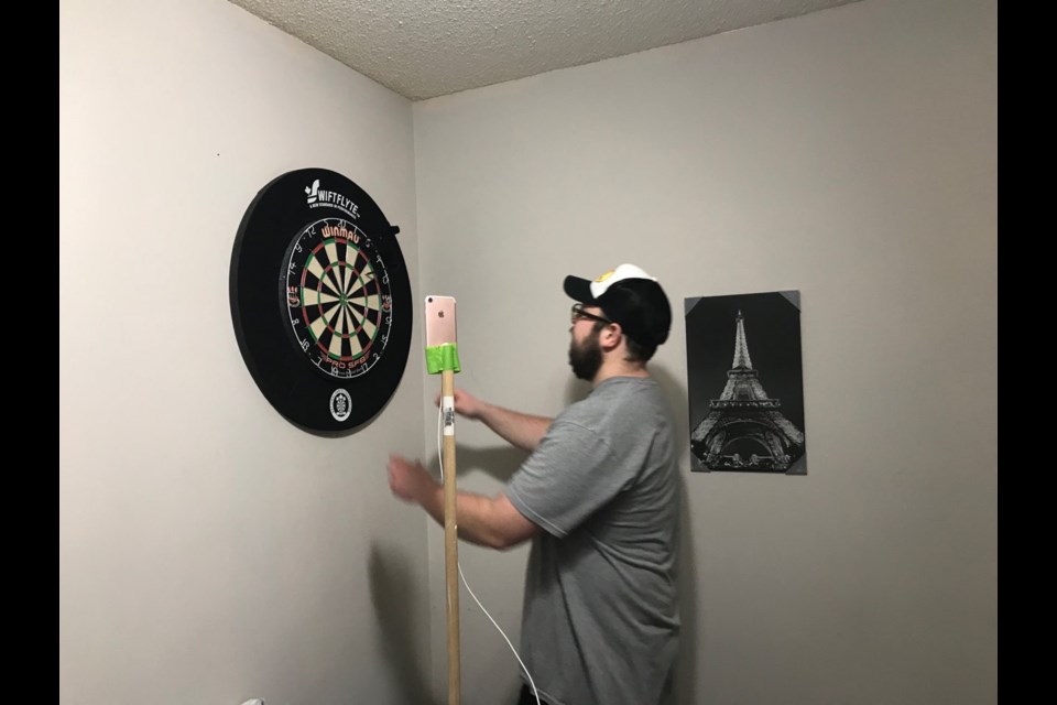After the Orillia Men's Dart League was put on hold due to the COVID-19 pandemic, Dave Luffman gathered a few players to resume play using the group video chat app Google Duo. Contributed photo