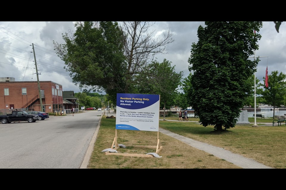 Multiple signs were erected near local beach parking lots last summer to let people know about the new restrictions the city put in place. Those restrictions will once again be in place Fridays through Sundays and holidays from June 4 to Labour Day. Dave Dawson/OrilliaMattters File Photo