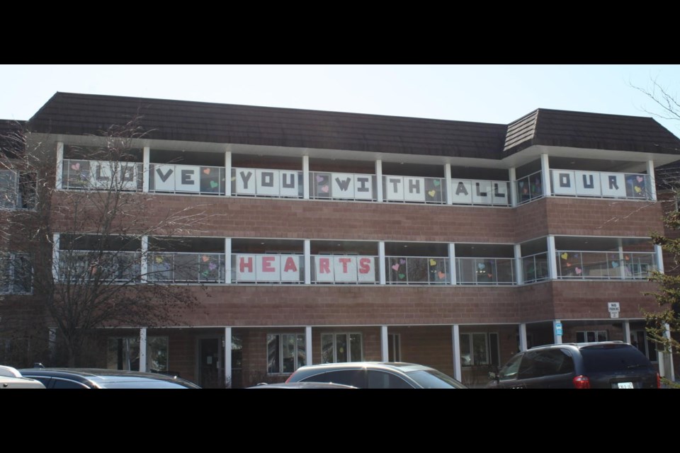 A message of love from staff and residents of the Leacock Care Centre is displayed from the balcony of the building. The facility has been placed in outbreak status after a staff member tested positive for the virus. OrilliaMatters File Photo
