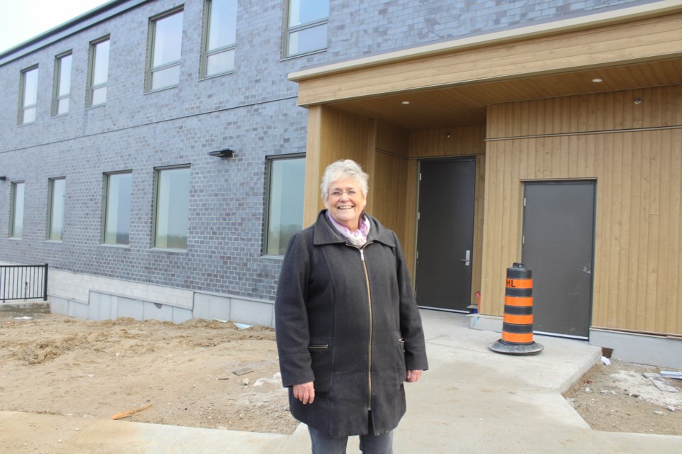 Liz Westcott, executive director of the Green Haven Shelter for Women, is shown in front the new facility being built on Sundial Drive. Nathan Taylor/OrilliaMatters