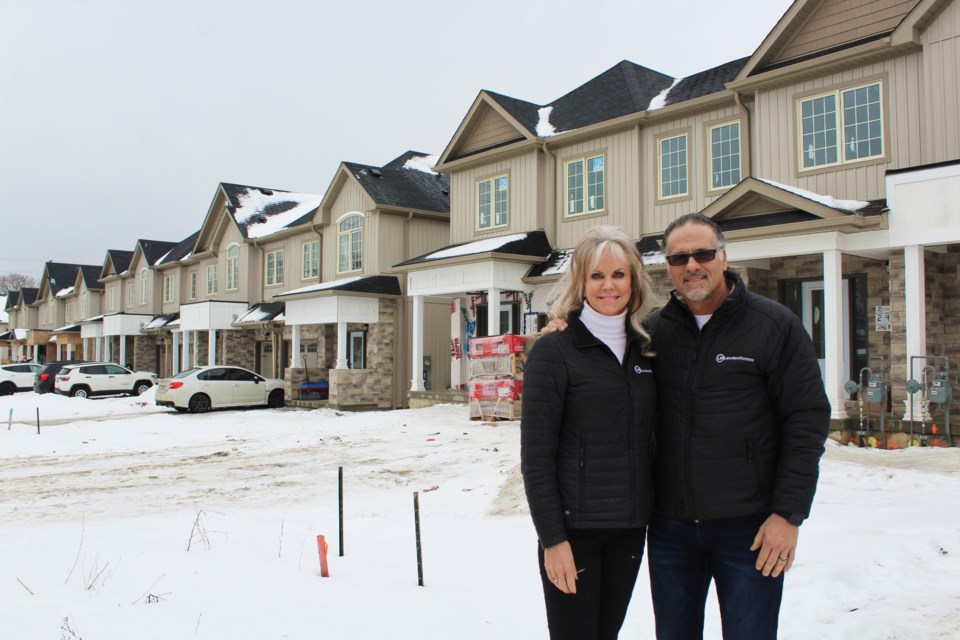 Bernadette Wainman and Dennis Bottero, of Landen Homes, are shown in front of Churchlea Mews, their townhouse development on James Street. Nathan Taylor/OrilliaMatters