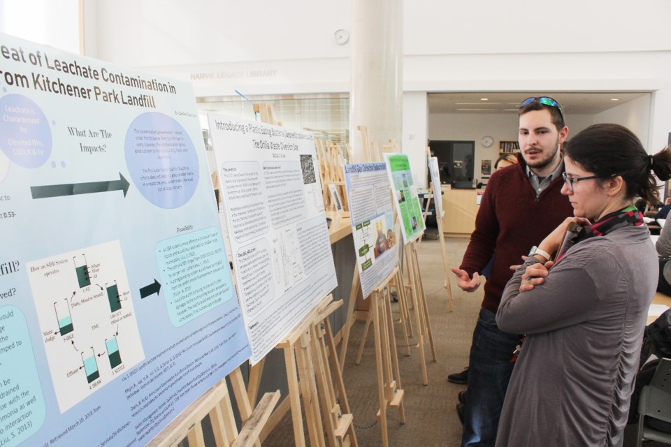 Undergraduate student Mathieu Farrow explains his project to associate professor Thamara Laredo on Wednesday during Research and Innovation Week at Lakehead University in Orillia. Nathan Taylor/OrilliaMatters