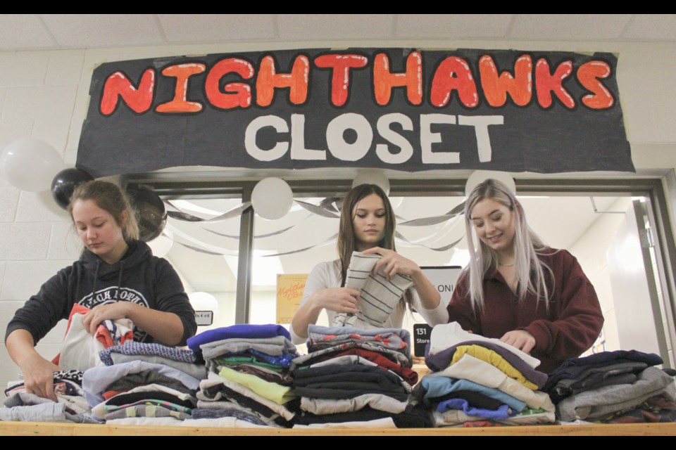 Nighthawks Closet opened Thursday at Orillia Secondary School. Helping out at the shop were, from left, students Angeline Chatzikyriakos, Eva Silvester and Victoria Scott. Nathan Taylor/OrilliaMatters