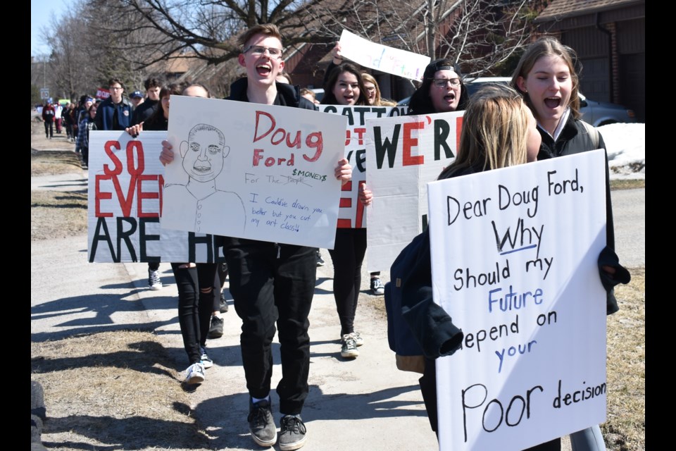 Twin Lakes Secondary School students carry signs as they protest cuts to education. Several hundred students from the school participated in the protest and march. Dave Dawson/OrilliaMatters