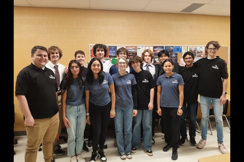 Members of the DECA club at Orillia Secondary School are shown with two of their three staff advisers.