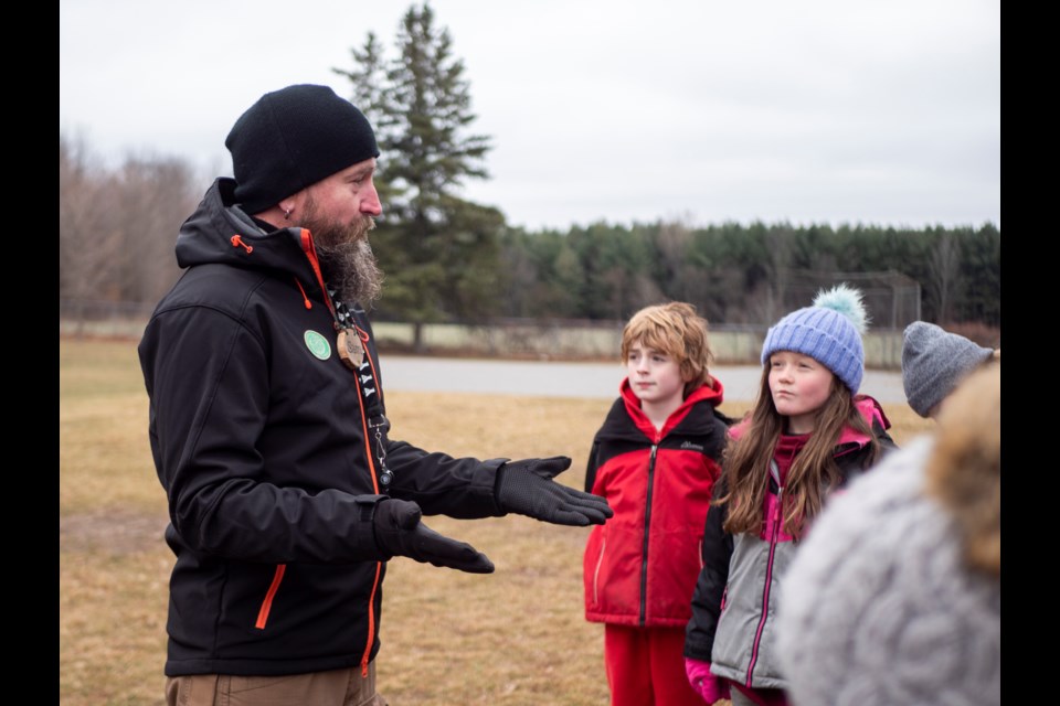 YMCA camping and outdoor education assistant manager Sam White gets Grade 4 science students out of the classroom for a hands-on learning experience.
