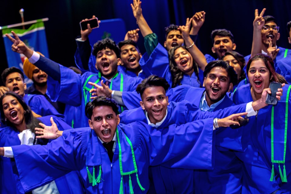 Students show their excitement upon graduating from Georgian College.