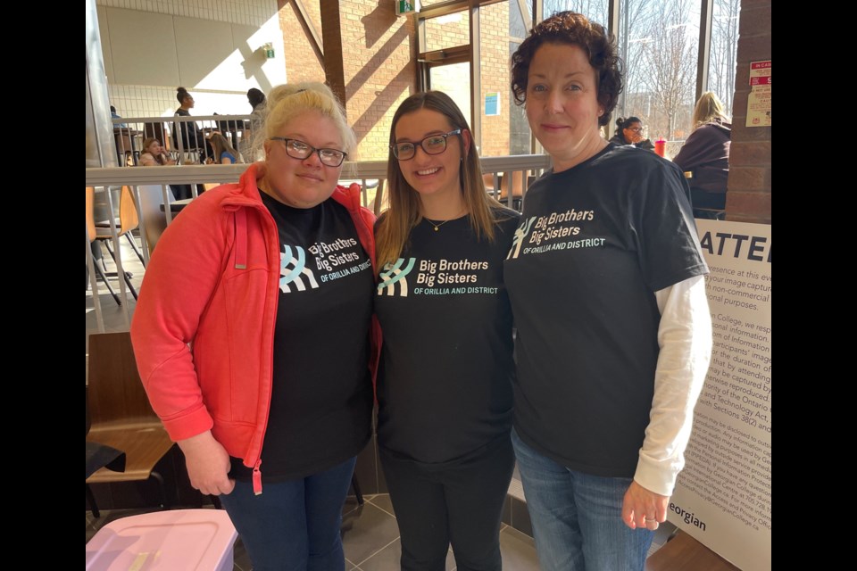Georgian College students from the child and youth care program supported Big Brothers Big Sisters (BBBS) of Orillia and District by holding an information session for recruitment earlier this week. From left are student Tania Ayers, BBBS mentoring co-ordinator Lauren Romanko and student Aimee Lincoln.