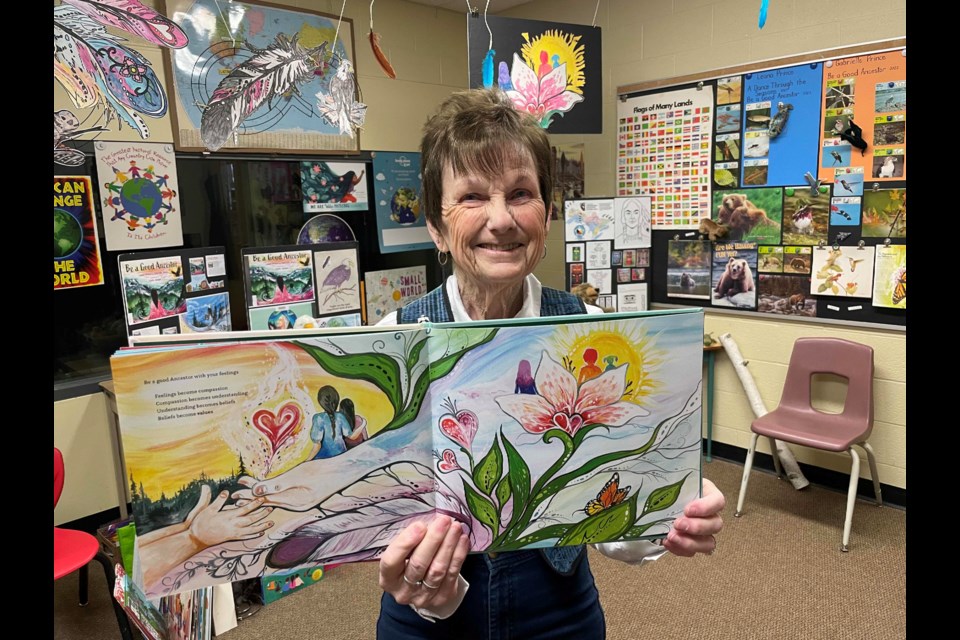 Glennis Canning is all smiles while sharing her love of reading and stories with students at Notre Dame Catholic School.