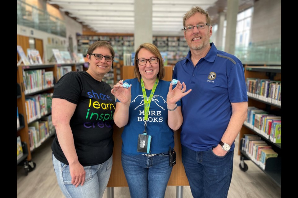 The Orillia Public Library is now equipped with Ozobots. From left are CEO Bessie Sullivan, director of children and youth, Meagan Wilkinson, and Kiwanis Club of Orillia member Don Haskins. 
