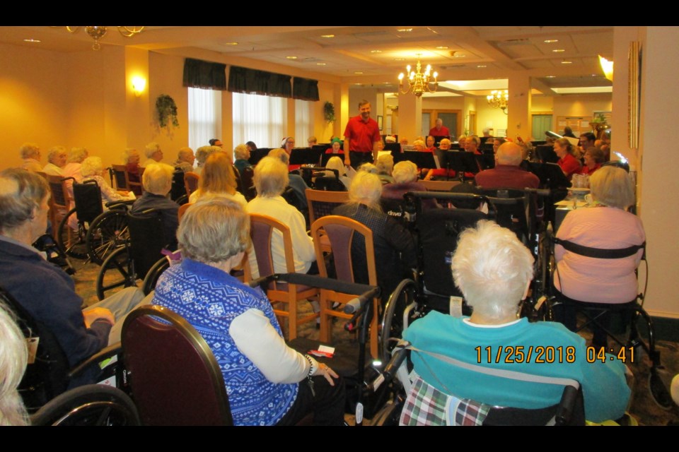 The sounds of the Christmas season rang out at Champlain Manor on Sunday, November 25, with a stellar performance from the 40-member
Orillia Concert Band, directed by James Hilts. The dining room and front lobby were overflowing with many residents who enjoyed the hour-long performance. Contributed photo