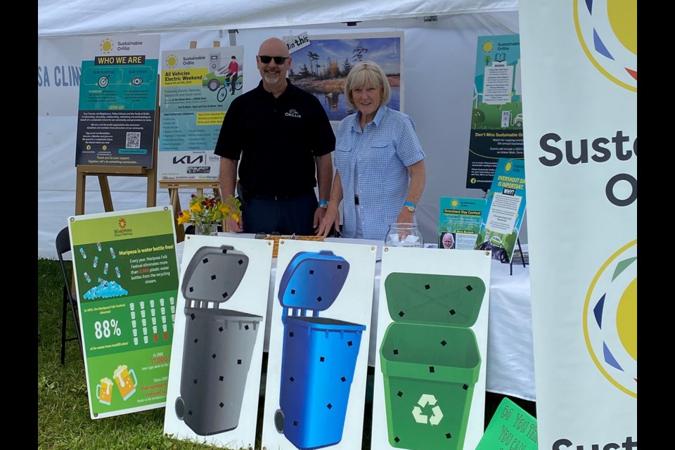 David Campbell, the city council liasion with Sustainable Orillia, helped out on the weekend at the Mariposa Folk Festival and is shown with volunteer Susanne Laperle.