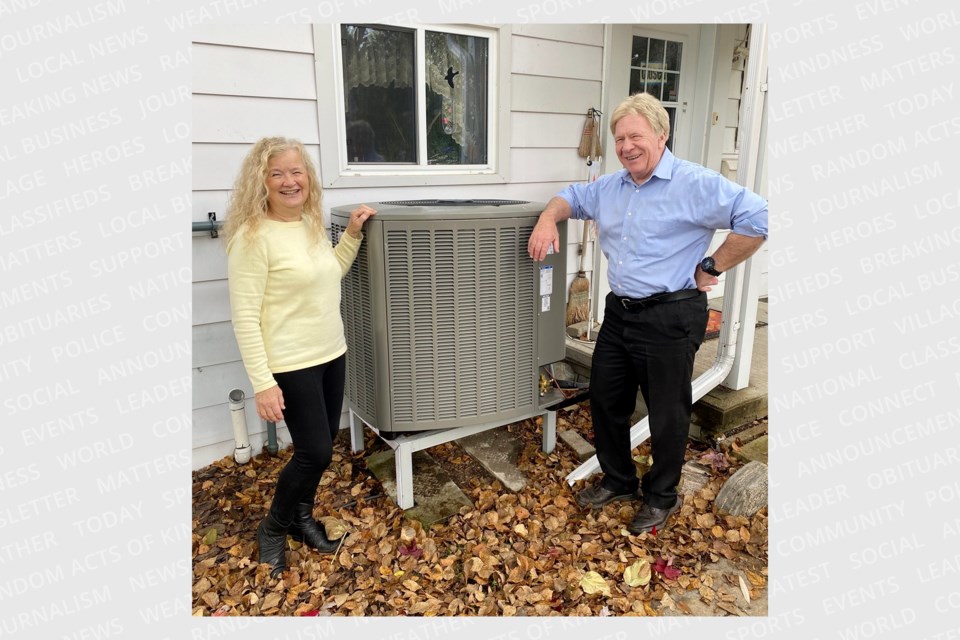 Donna Gowland and Jim McMahon beside their new heat pump.