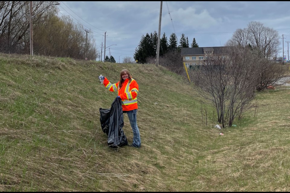 To celebrate Earth Day, Kubota Materials Corporation employees and families collected more than 40 bags of trash and recyclables on Saturday. Above is Kubota Health and Safety Specialist, Carrie Creamer.