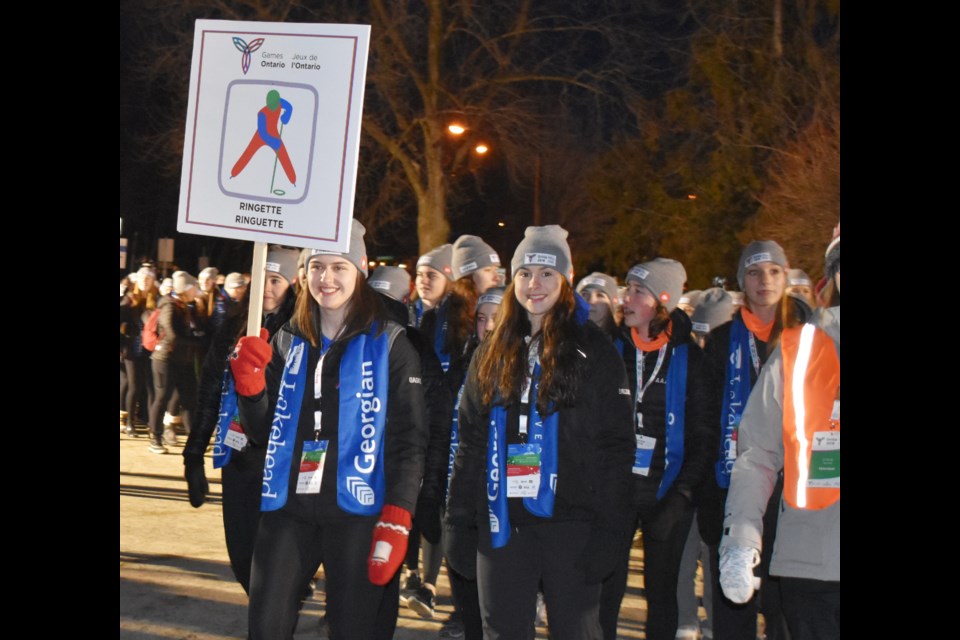 Athletes carry their banner as they enter Couchiching Beach Park as part of the opening ceremony
for the 2018 Ontario Winter Games. The city is bidding to host a similar event in 2023 for athletes 55 and older. Dave Dawson/OrilliaMatters