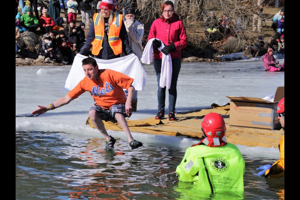 Ryan Smith of Orillia jumped into frigid  Lake Couchiching Saturday as part of this year's polar bear dip, one of the highlights of the annual Orillia Winter Carnival. Mehreen Shahid/OrilliaMatters
