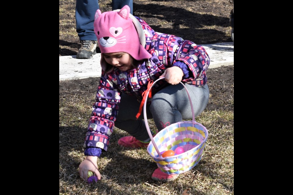This little girl was all smiles as she discovered one of the colourful eggs hidden around the grounds of the Opera House Saturday morning as part of the Great Easter Egg Hunt in downtown Orillia. Dave Dawson/OrilliaMatters