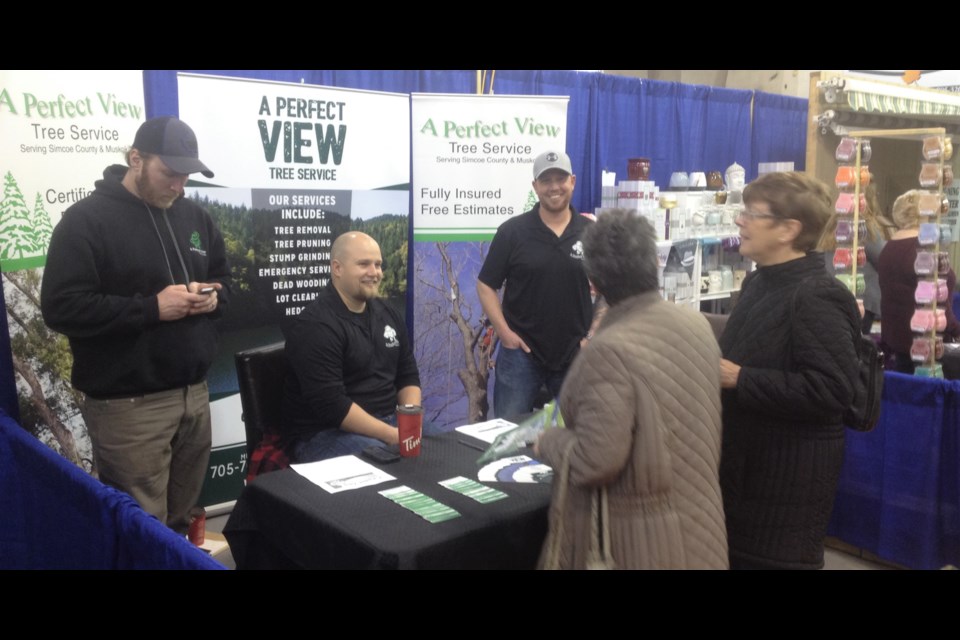 People crowd around A Perfect View Tree Service at last year's Simcoe Spring Home and Cottage Show. This year's event starts Friday at Barnfield Point Recreation Centre and goes all weekend.