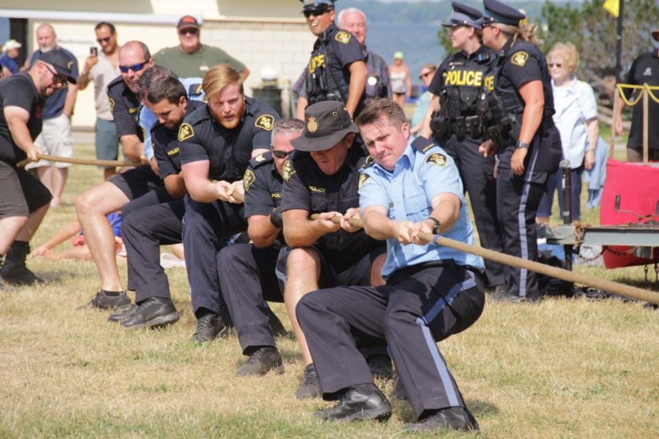 The OPP weren’t ready to give up just yet and put all their effort into winning the tug of war competition against their counterparts from the Orillia Fire Department Saturday. Mehreen Shahid/OrilliaMatters