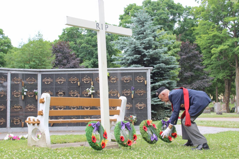 Cliff Vardy, of the Royal Canadian Legion in Orillia, lays a wreath Sunday during the Decoration Day ceremony at St. Andrew's-St. James' Cemetery. Nathan Taylor/OrilliaMatters