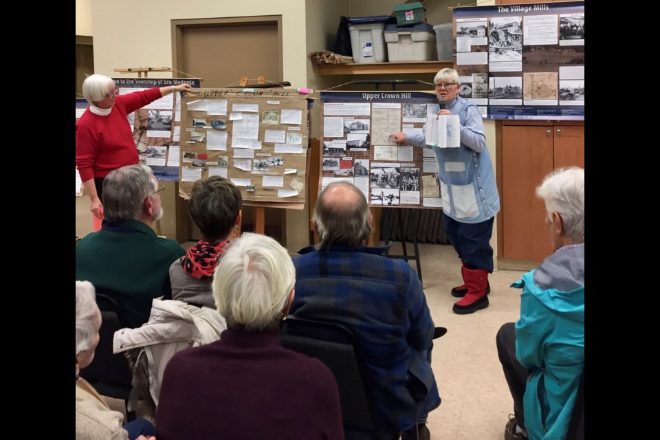Sheila Craig, left, and Joanna McEwen are shown talking about the story board created for the history of Penetanguishene Road. They were the guest speakers at the Orillia Museum of Art and History's History Speaker Series recently. Supplied photo