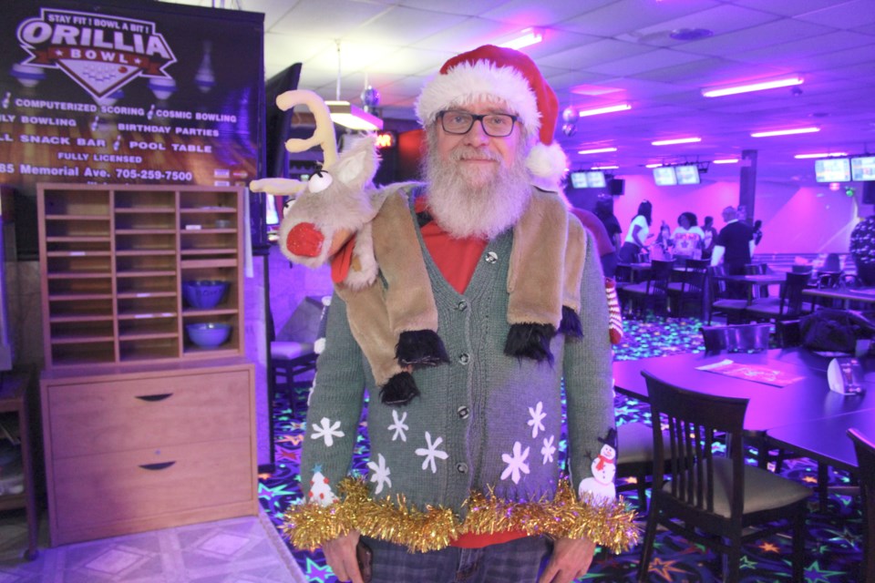 Evan Devine dressed to impress at the Ugly Sweater Bowling Party on Friday at Orillia Bowl. Nathan Taylor/OrilliaMatters