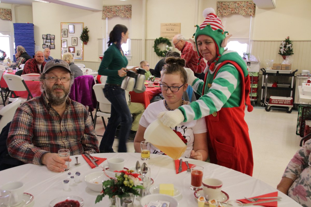 Church volunteers serve up Christmas dinner with helping of hope and