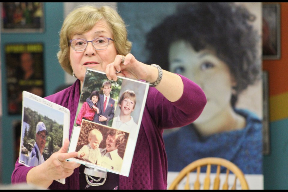 Evelyn Pollock holds photos of her son, Daniel, during the Opioids in Our Community discussion Thursday at the Orillia Youth Centre. Daniel died of an accidental overdose in 2017. Nathan Taylor/OrilliaMatters