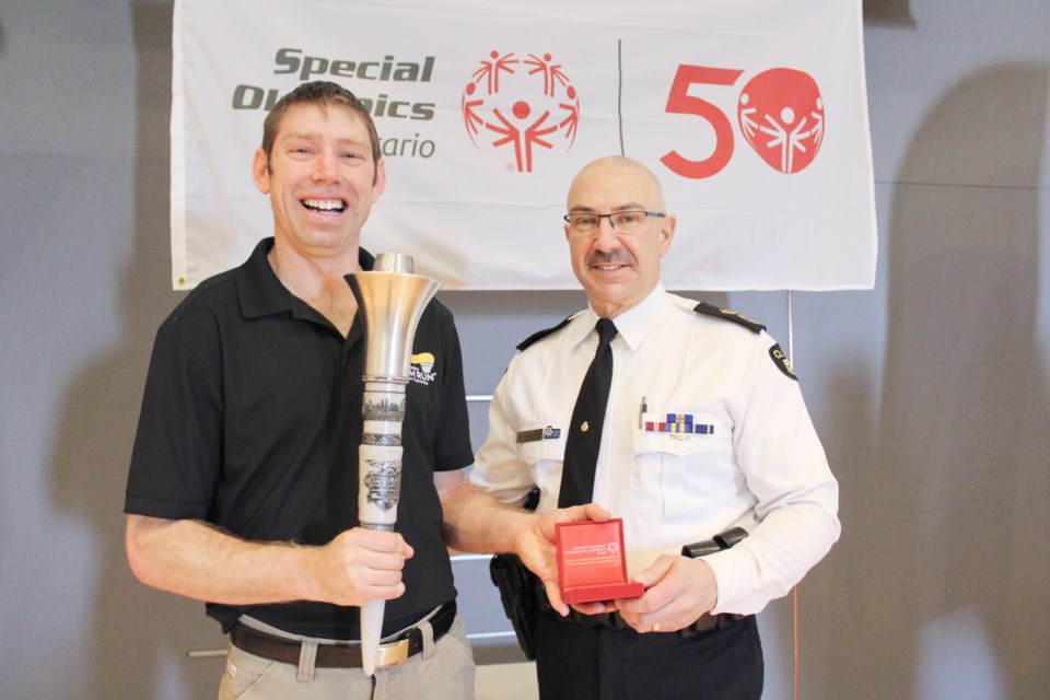 Special Olympian Stephen Graham is shown with Interim OPP Commissioner Gary Couture at OPP General Headquarters on Monday. Couture presented the Orillia athlete with the Special Olympics 50th-anniversary medal. Nathan Taylor/OrilliaMatters