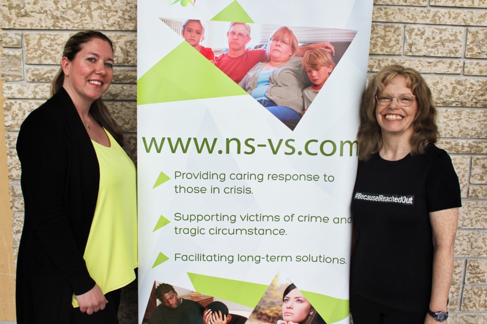 Melina Stoutt, left, is shown with Frances Yarbrough, executive director of North Simcoe Victim Services, during an event Thursday at OPP General Headquarters. Stoutt was sexually assaulted in 2011 and she is thankful for the support of victim services. Nathan Taylor/OrilliaMatters