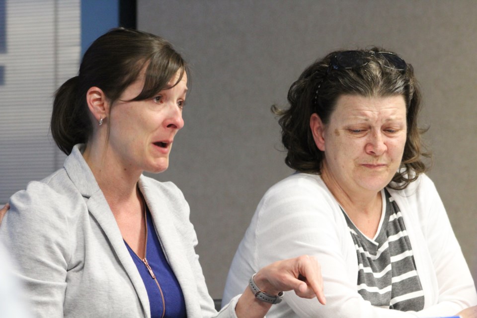 Julie McCrackin, a special-education teacher, couldn't hold back her emotions Wednesday during a roundtable discussion about autism hosted by Simcoe North MPP Jill Dunlop. McCrackin is shown with Shirley Tessier, whose autistic children are taught by McCrackin. Nathan Taylor/OrilliaMatters
