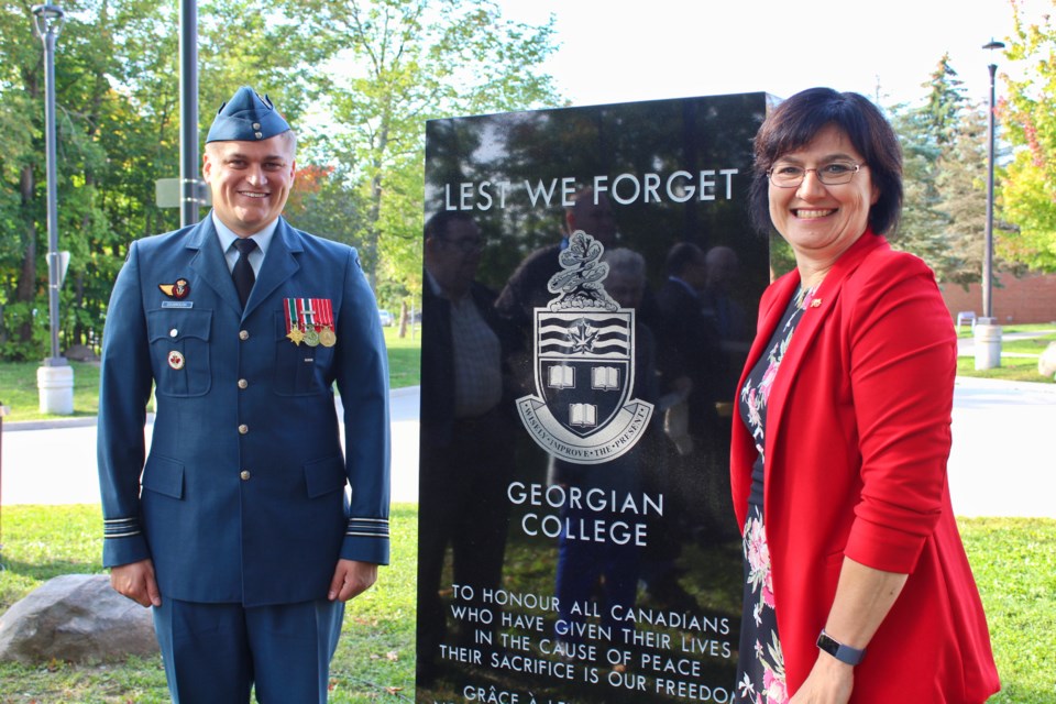 Maj. Kevin Doubrough and his aunt, Terri Doubrough, are shown Wednesday with the new cenotaph at Georgian College's Orillia campus. The cenotaph was the idea of Terri Doubrough, a library technician with the college. Nathan Taylor/OrilliaMatters