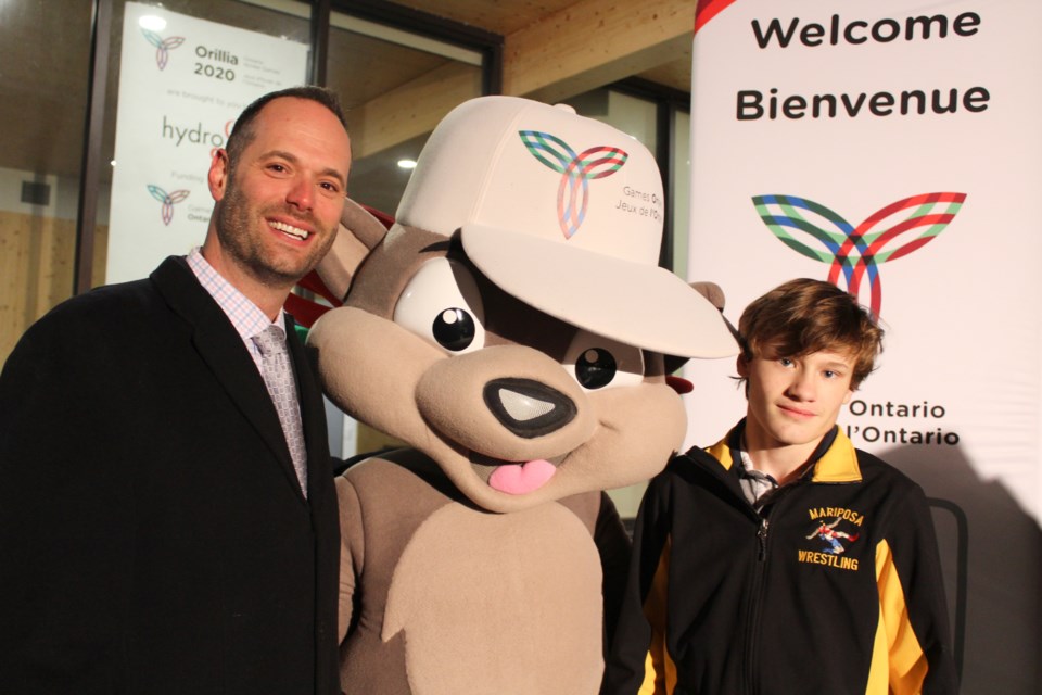 Jed Levene, left, chair of the Orillia 2020 Ontario Winter Games organizing committee, is shown with mascot Pachi and Domenick Ritchie, who won a silver medal in wrestling at the 2018 games. The three were on hand Tuesday at the Orillia Waterfront Centre to start the 100-day countdown to the 2020 games. Nathan Taylor/OrilliaMatters